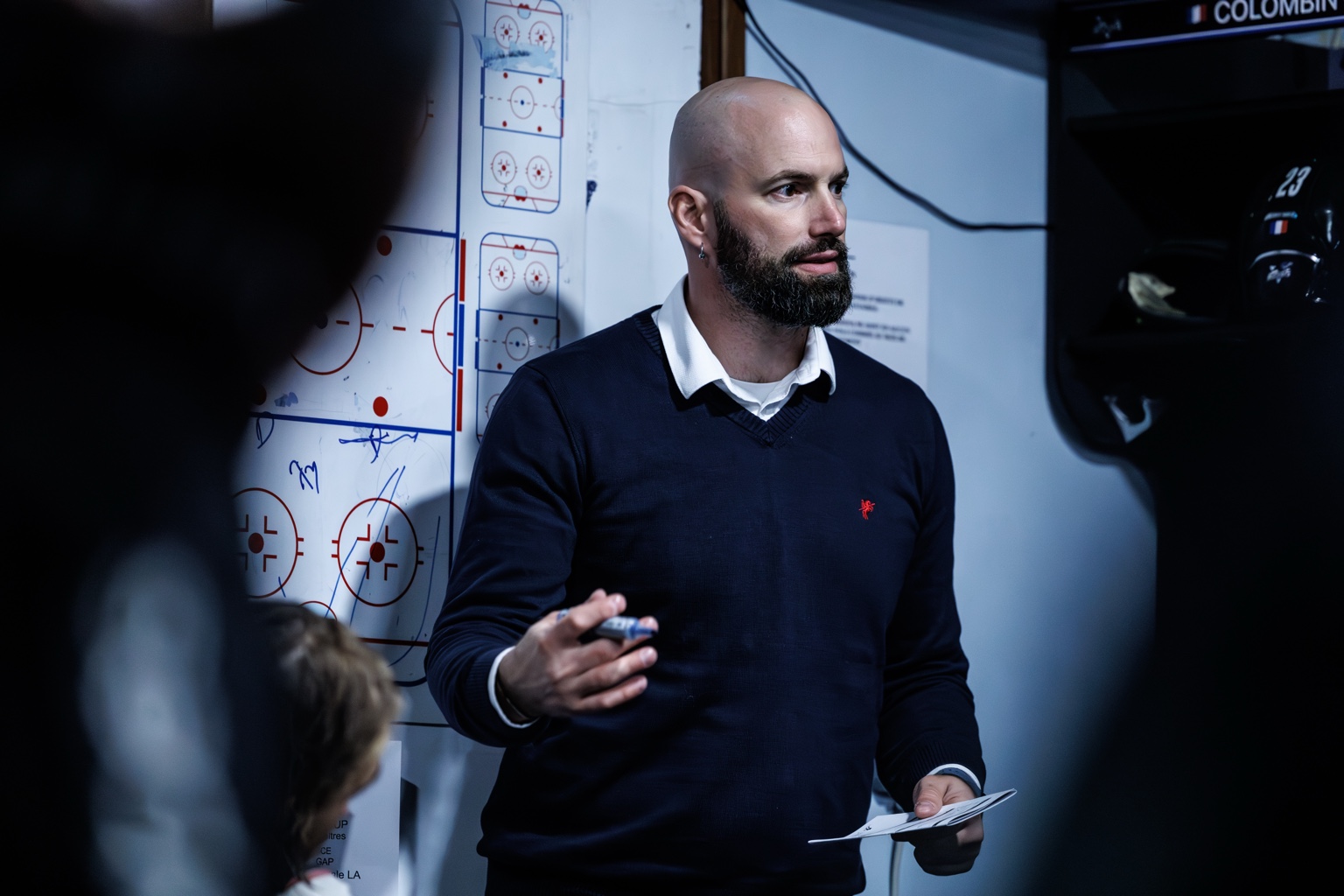 Coach explaining tactics at a board